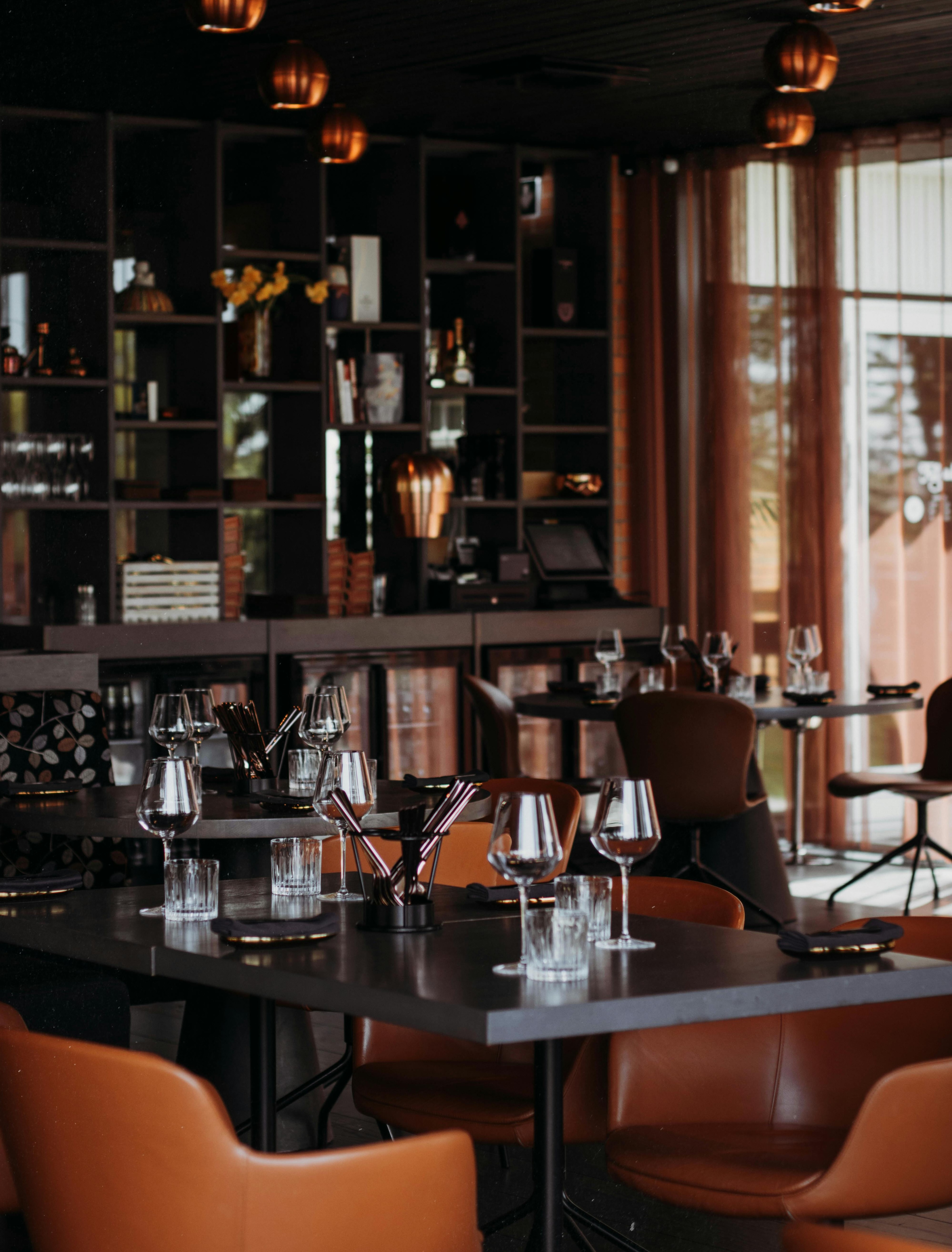 Empty restaurant tables set and waiting